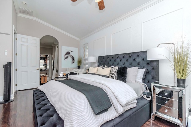 bedroom with crown molding, ceiling fan, lofted ceiling, and dark wood-type flooring