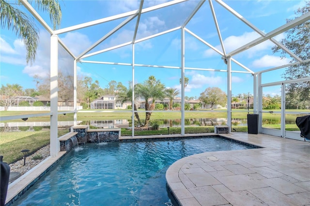 view of pool featuring a lanai, a yard, a water view, a patio area, and pool water feature