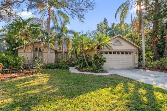 single story home featuring a garage and a front lawn