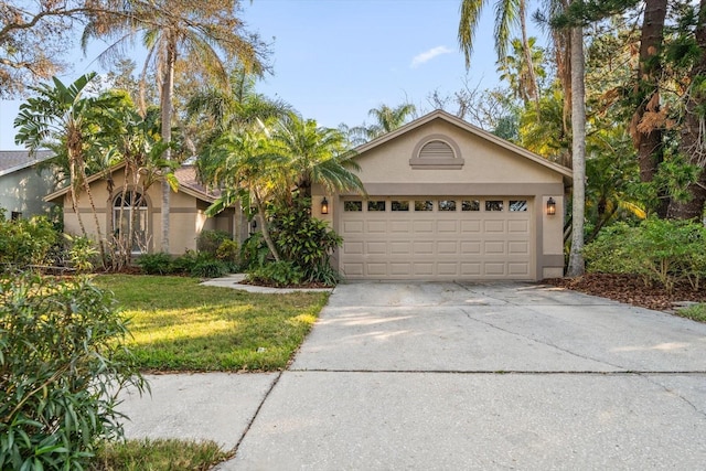 ranch-style home featuring a garage and a front yard