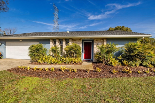 ranch-style home with a garage and a front yard