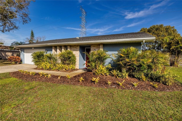 single story home featuring a garage and a front yard