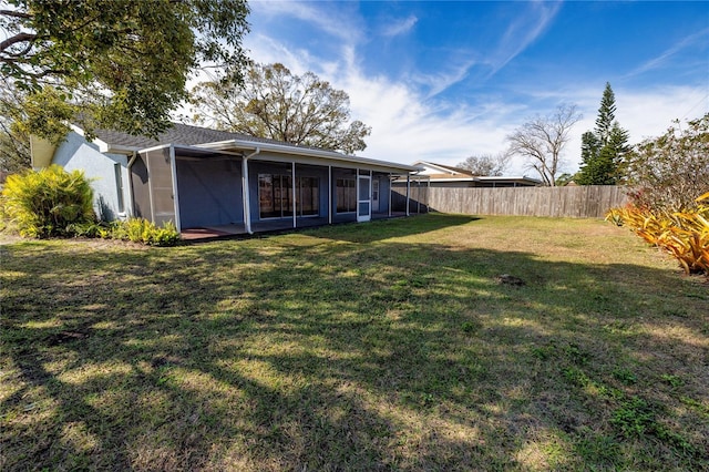 view of yard with a sunroom