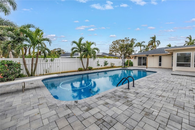 view of swimming pool with a patio area