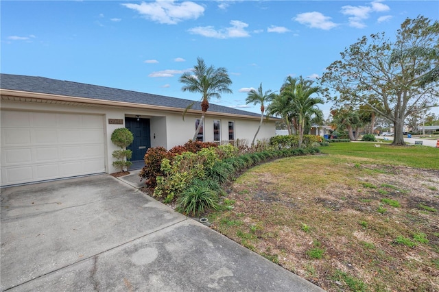 view of front of home with a garage and a front yard