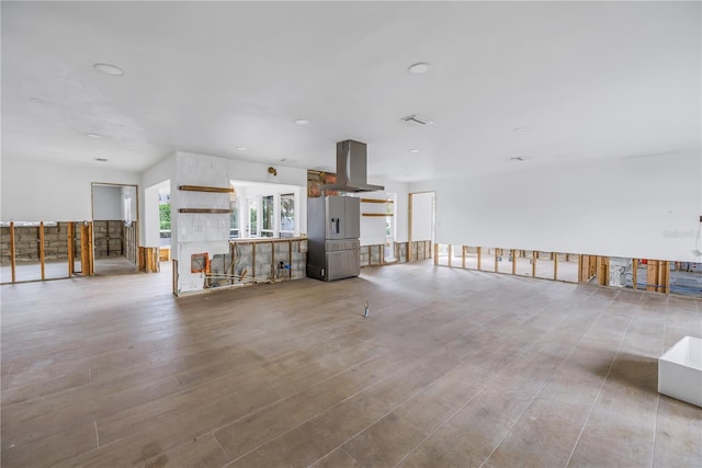 unfurnished living room featuring light hardwood / wood-style floors