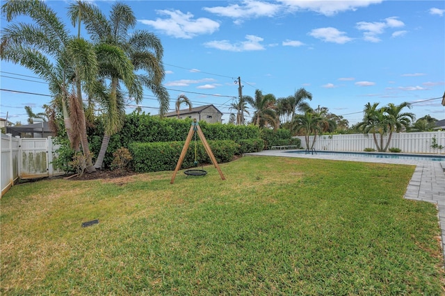 view of yard featuring a fenced in pool