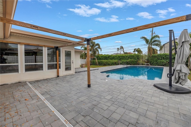 view of pool featuring a patio