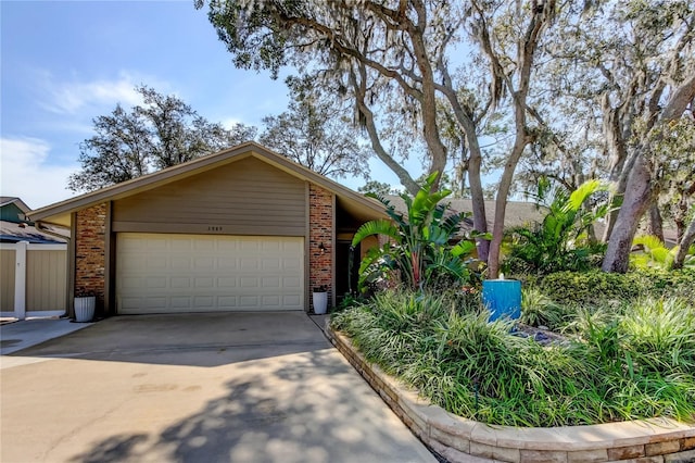 ranch-style home featuring a garage