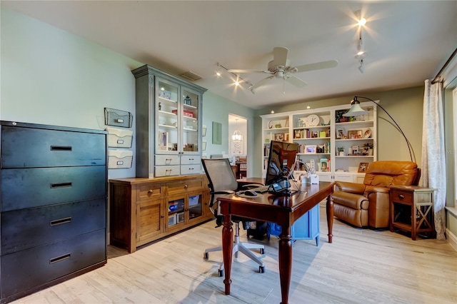 office area with ceiling fan, rail lighting, and light hardwood / wood-style floors