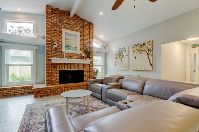 living room featuring high vaulted ceiling, a wealth of natural light, beam ceiling, and a brick fireplace