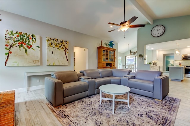 living room featuring beam ceiling, light hardwood / wood-style flooring, high vaulted ceiling, and ceiling fan