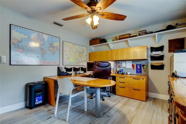 office space featuring light hardwood / wood-style flooring and ceiling fan