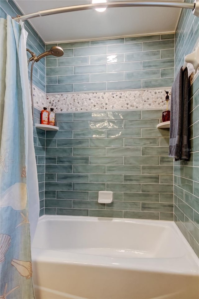 bathroom with shower / bath combination with curtain