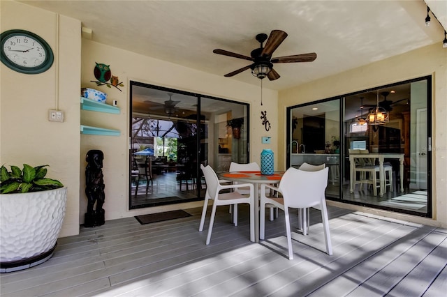 interior space with ceiling fan