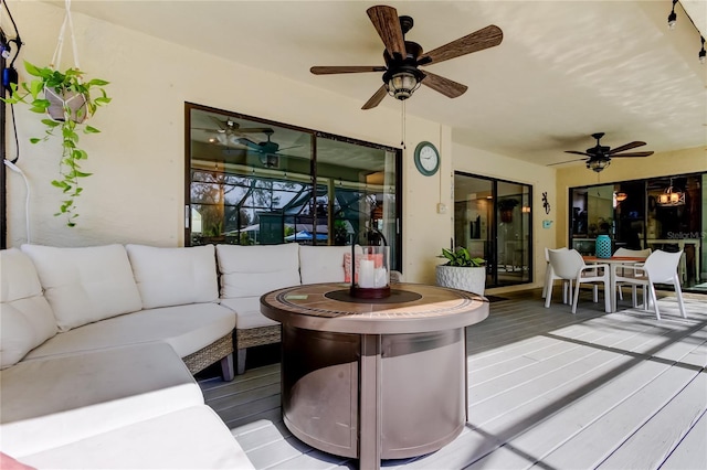 exterior space featuring an outdoor hangout area and ceiling fan