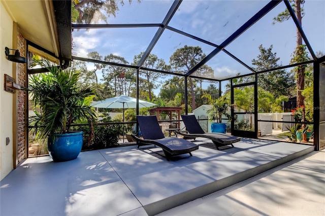 view of patio with glass enclosure