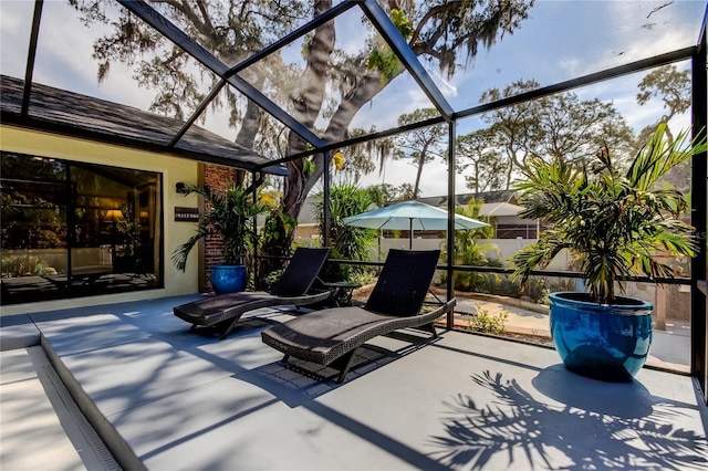 view of patio / terrace featuring glass enclosure