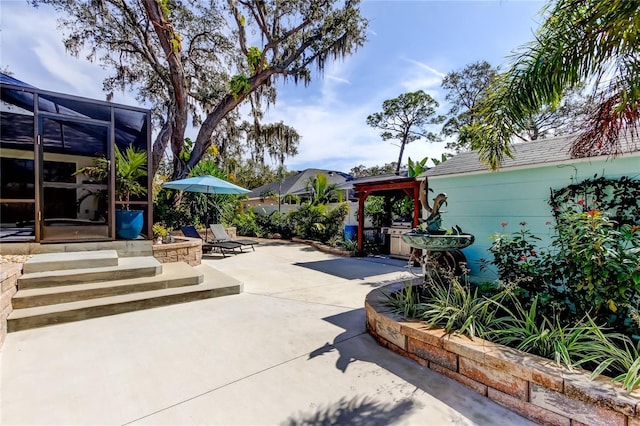 view of patio featuring a gazebo and a lanai