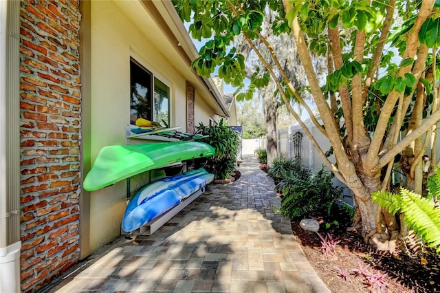 view of side of property featuring a patio