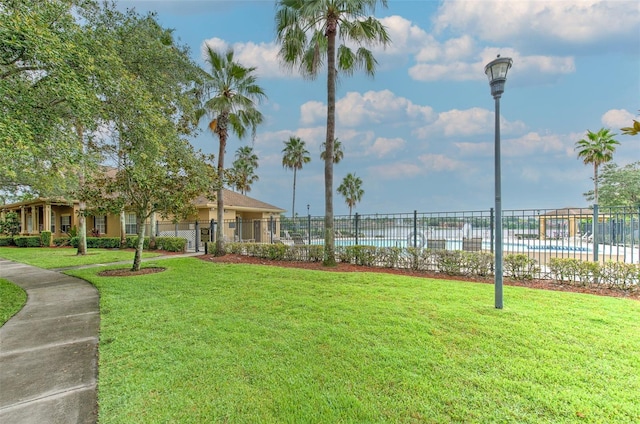 view of yard featuring a community pool