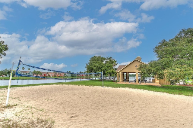 view of community featuring a gazebo, a water view, and volleyball court