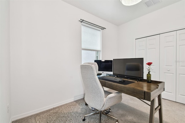 home office featuring light colored carpet, visible vents, and baseboards