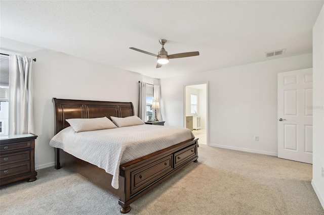 bedroom featuring light carpet, visible vents, and baseboards