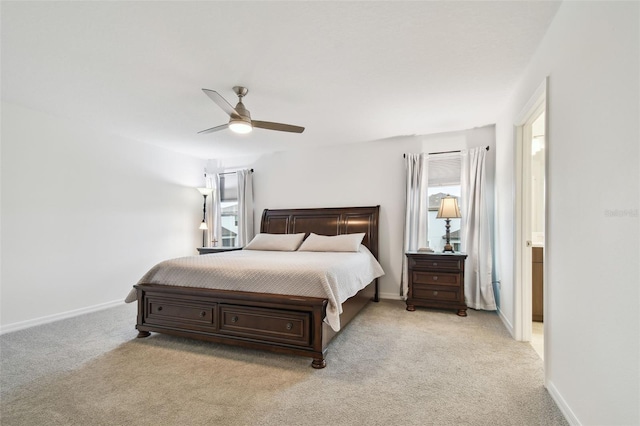 bedroom with light carpet, ceiling fan, and baseboards