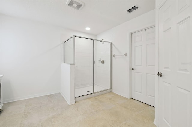 full bathroom with tile patterned flooring, visible vents, a shower stall, and baseboards