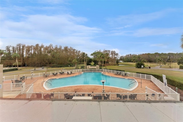 view of pool featuring a patio