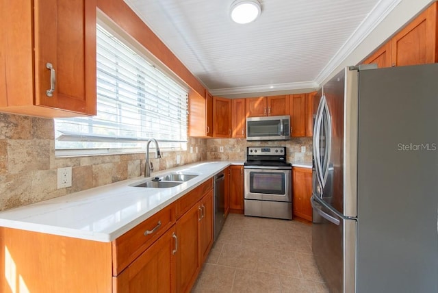 kitchen with sink, crown molding, appliances with stainless steel finishes, backsplash, and light tile patterned flooring