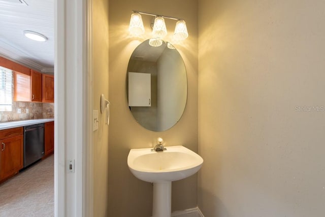 bathroom featuring tile patterned flooring and backsplash