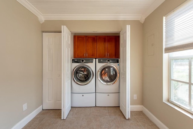 clothes washing area with cabinets, independent washer and dryer, crown molding, and light tile patterned floors