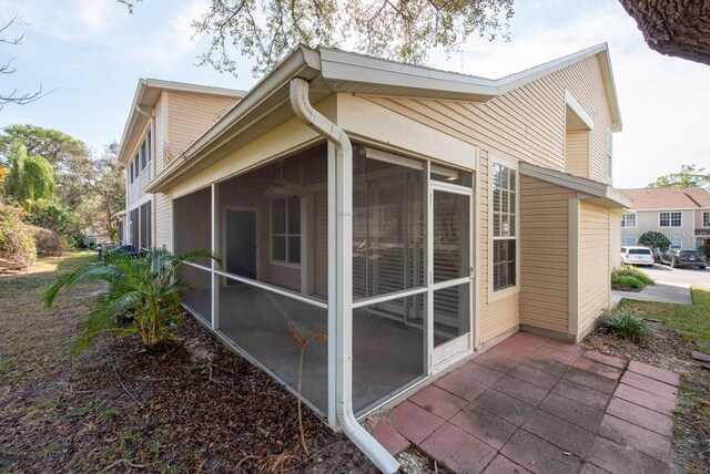 view of home's exterior featuring a sunroom