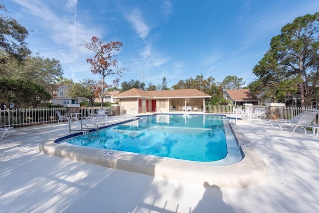 view of swimming pool with a patio area