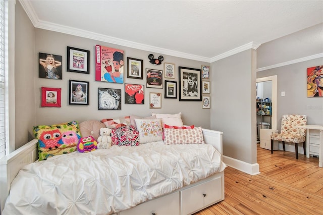 bedroom with ornamental molding and light wood-type flooring