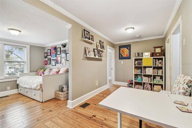 office area featuring hardwood / wood-style flooring, crown molding, and a textured ceiling