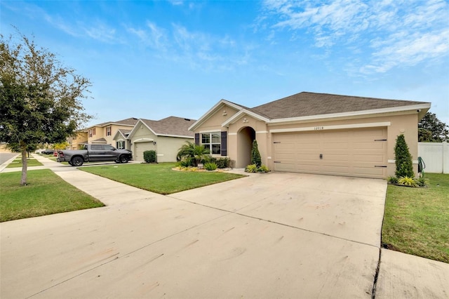 ranch-style home with a garage and a front yard