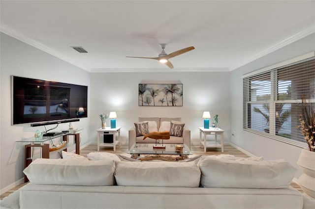 living room featuring crown molding, light wood-type flooring, and ceiling fan