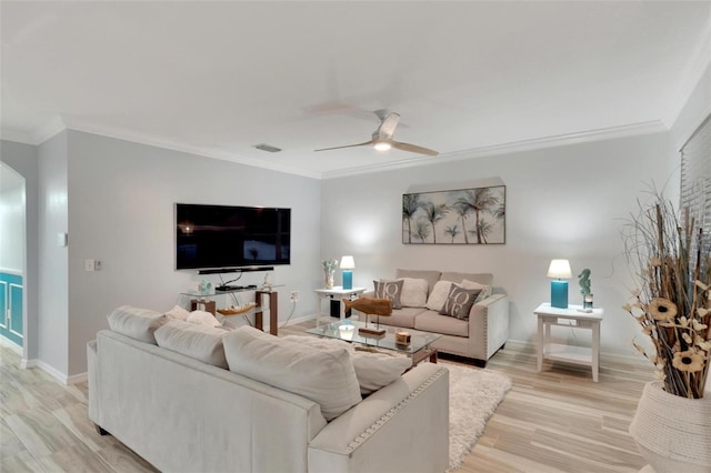 living room featuring crown molding, ceiling fan, and light wood-type flooring