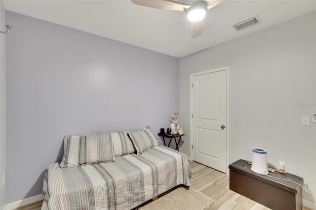 bedroom featuring ceiling fan and light hardwood / wood-style flooring