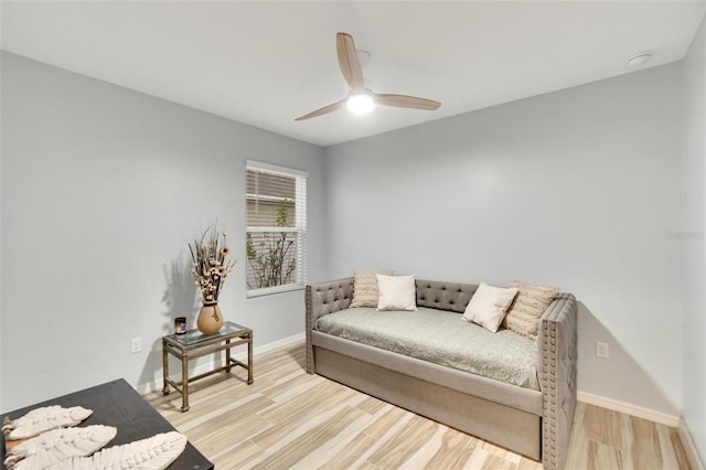 sitting room featuring ceiling fan and light hardwood / wood-style floors