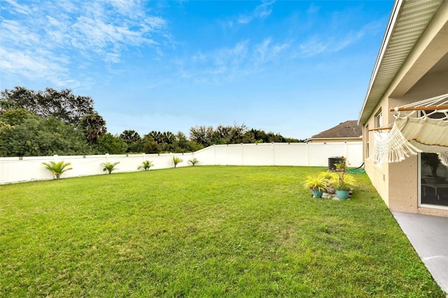 view of yard featuring central AC