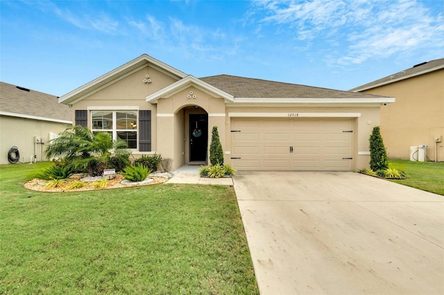 ranch-style house featuring a garage and a front lawn