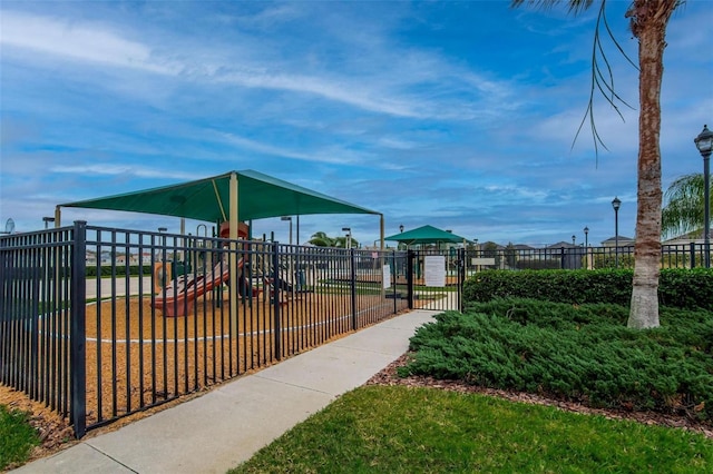 view of community featuring a lawn and a playground