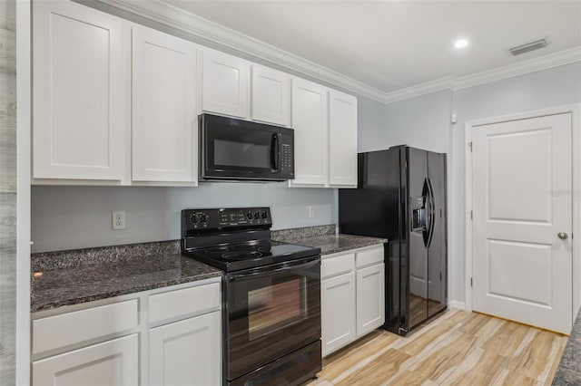 kitchen featuring light wood-type flooring, visible vents, black appliances, ornamental molding, and white cabinetry