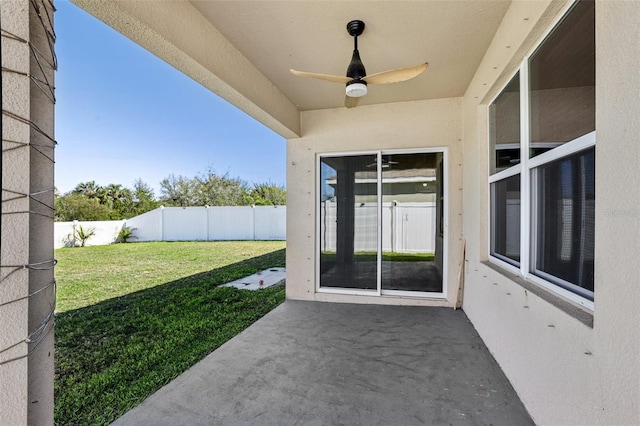 exterior space with a patio area, ceiling fan, and a fenced backyard