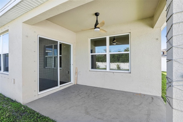 view of patio featuring ceiling fan