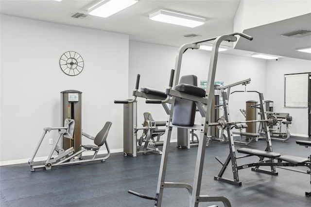 exercise room featuring visible vents and baseboards